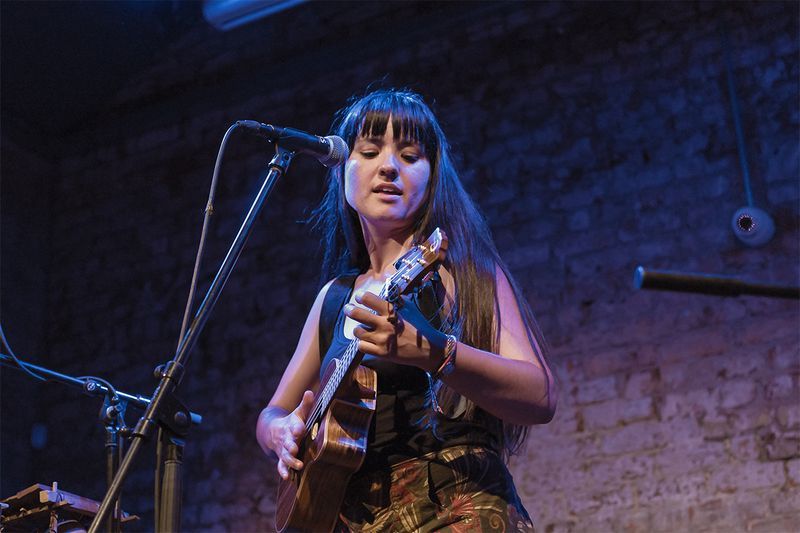 Woman playing the ukulele
