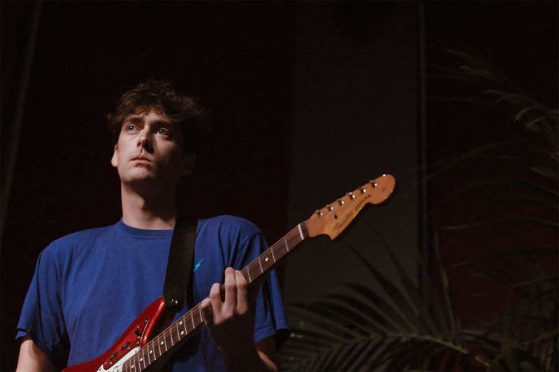 Bassist playing while lost in the music